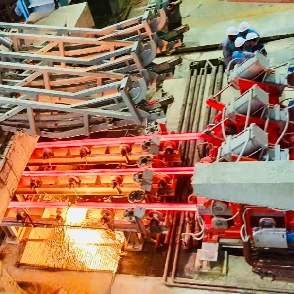 Red-hot steel billets running through an ISC rolling mill